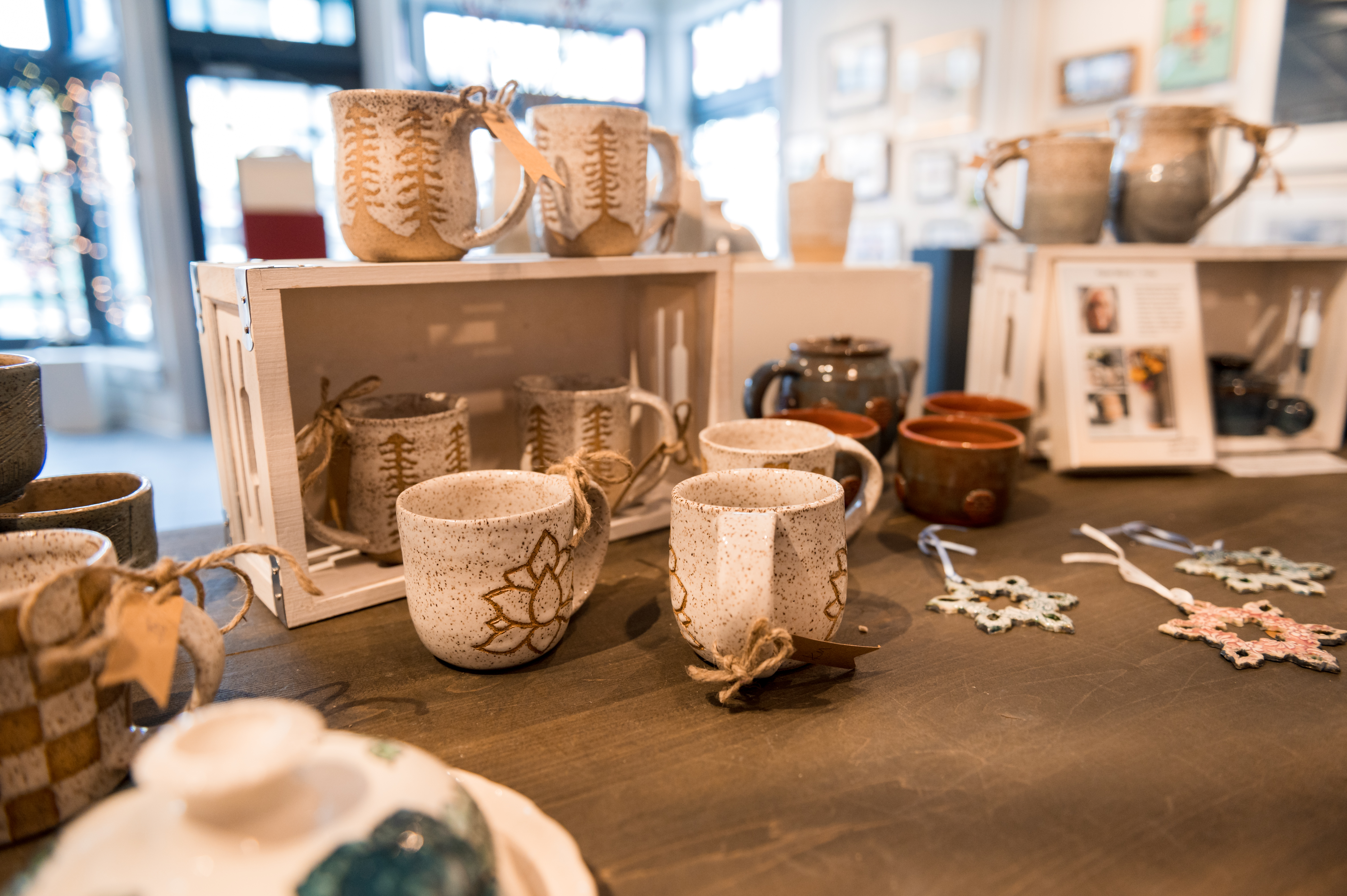 A collection of various handmade mugs and ceramics