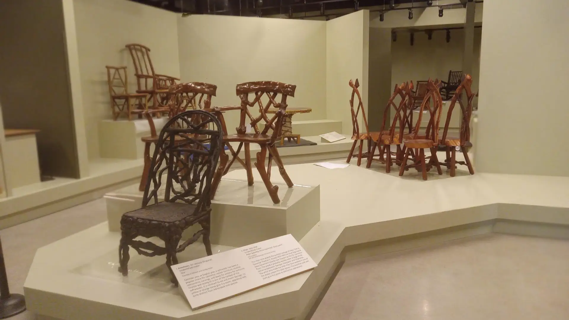 A new exhibit displaying many intricate, handmade chairs from centuries past