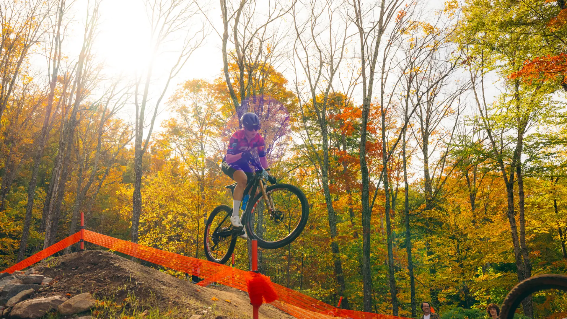 A competitor launch off of one of the jumps.