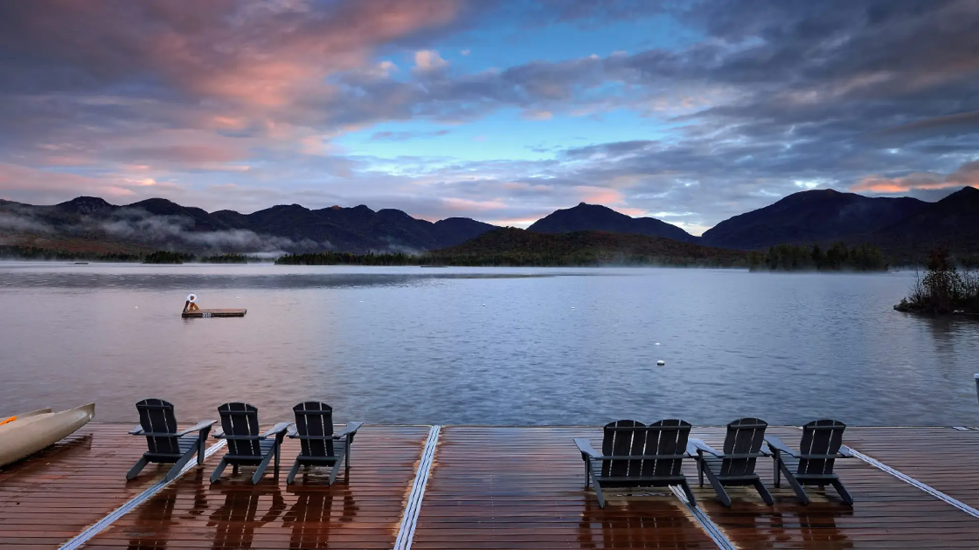 Sunset view of the high peaks from Elk Lake Lodge docks