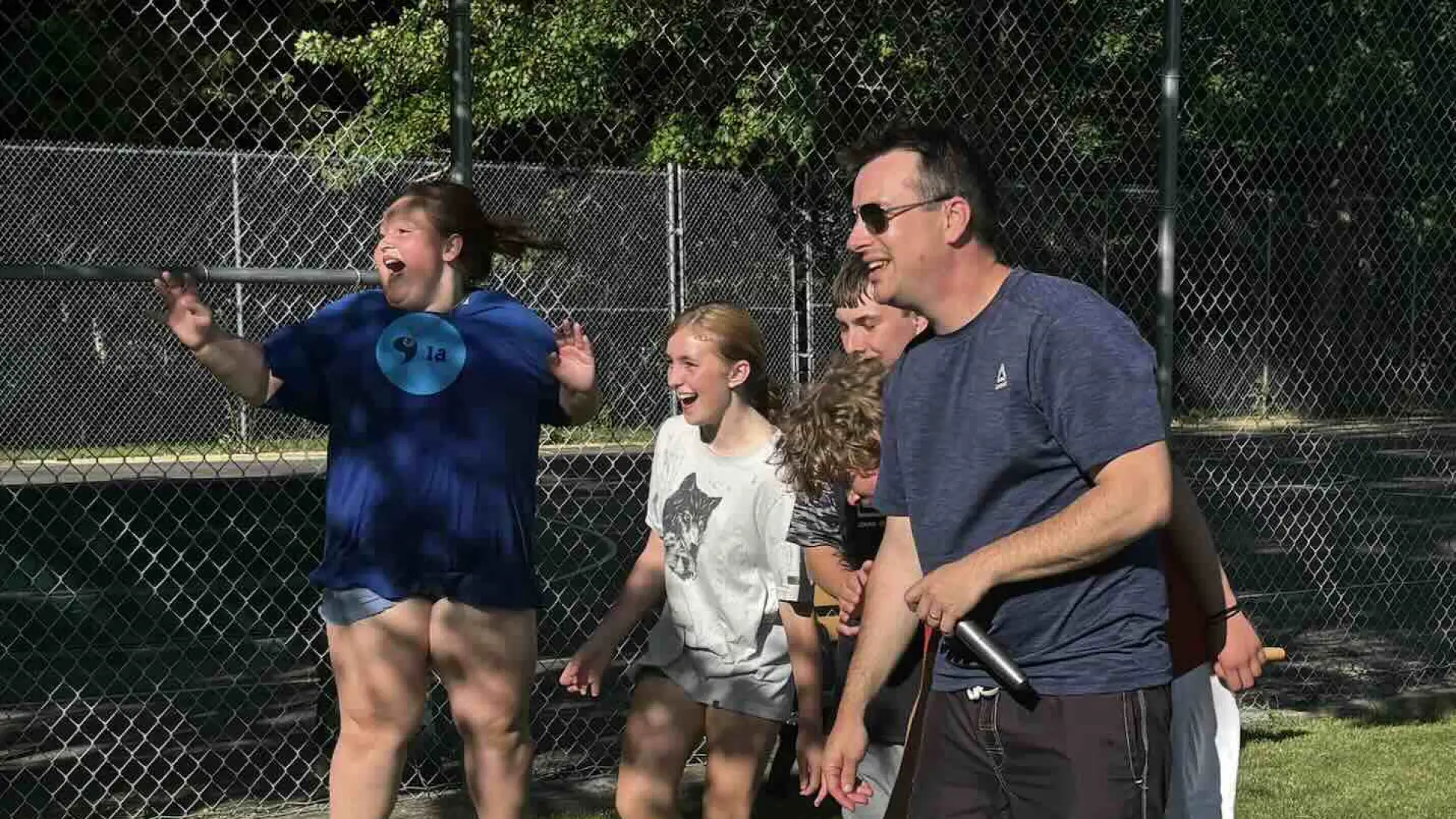 teens having water relay races