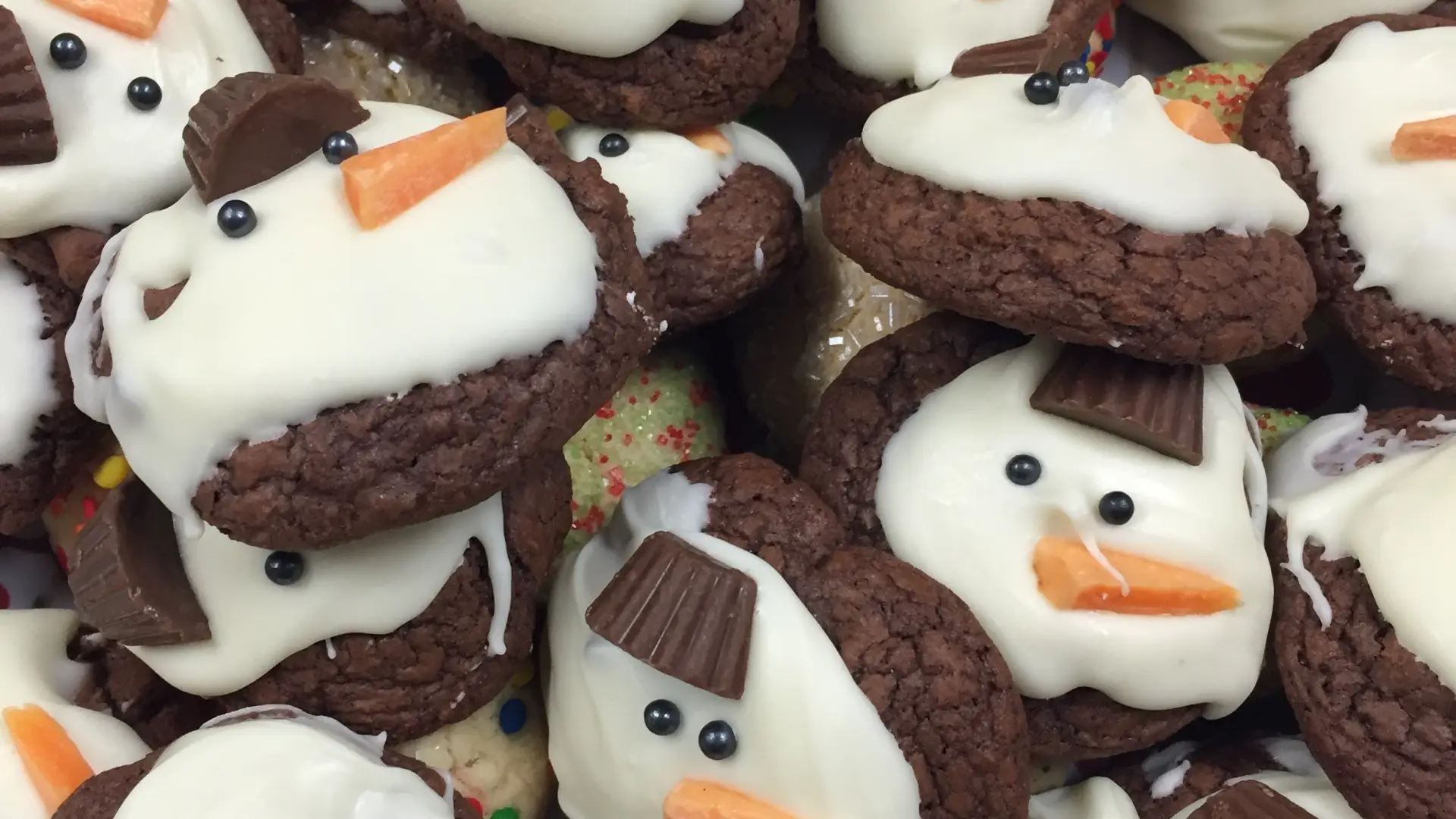 A photo of a pile of home-made snowman cookies