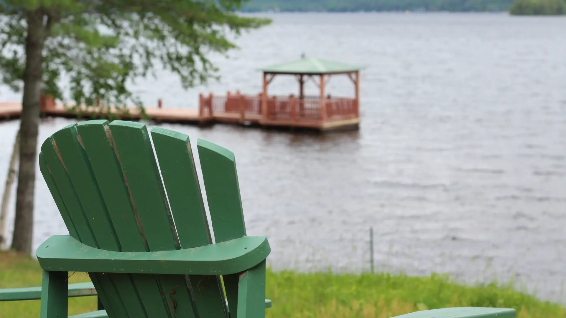 A gazebo floating on a dock in the water.