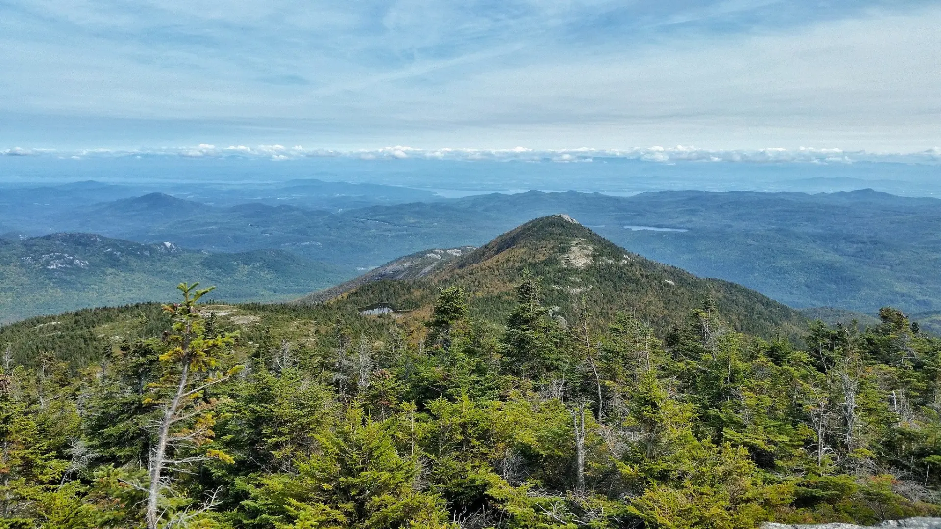 The view of a pointy mountain from above