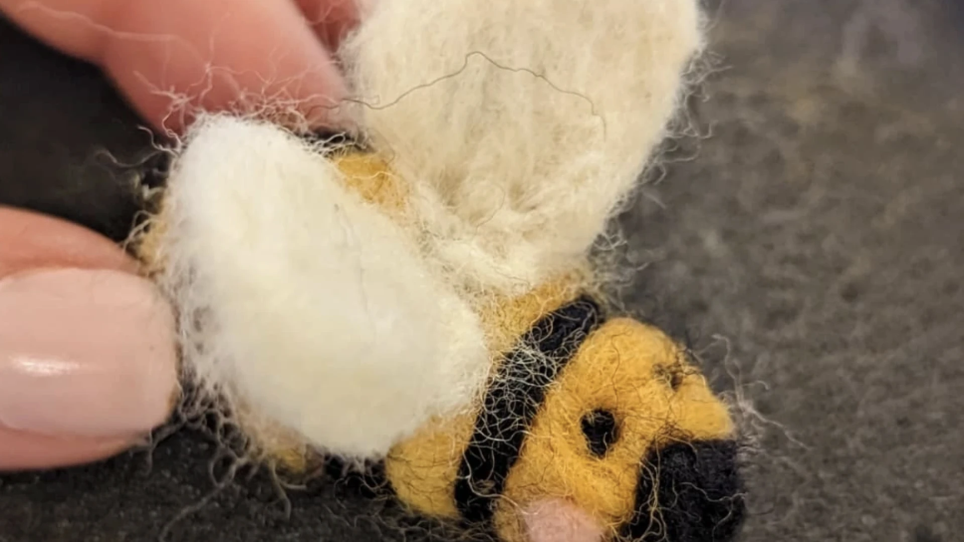 Close up of a needle felted bee.
