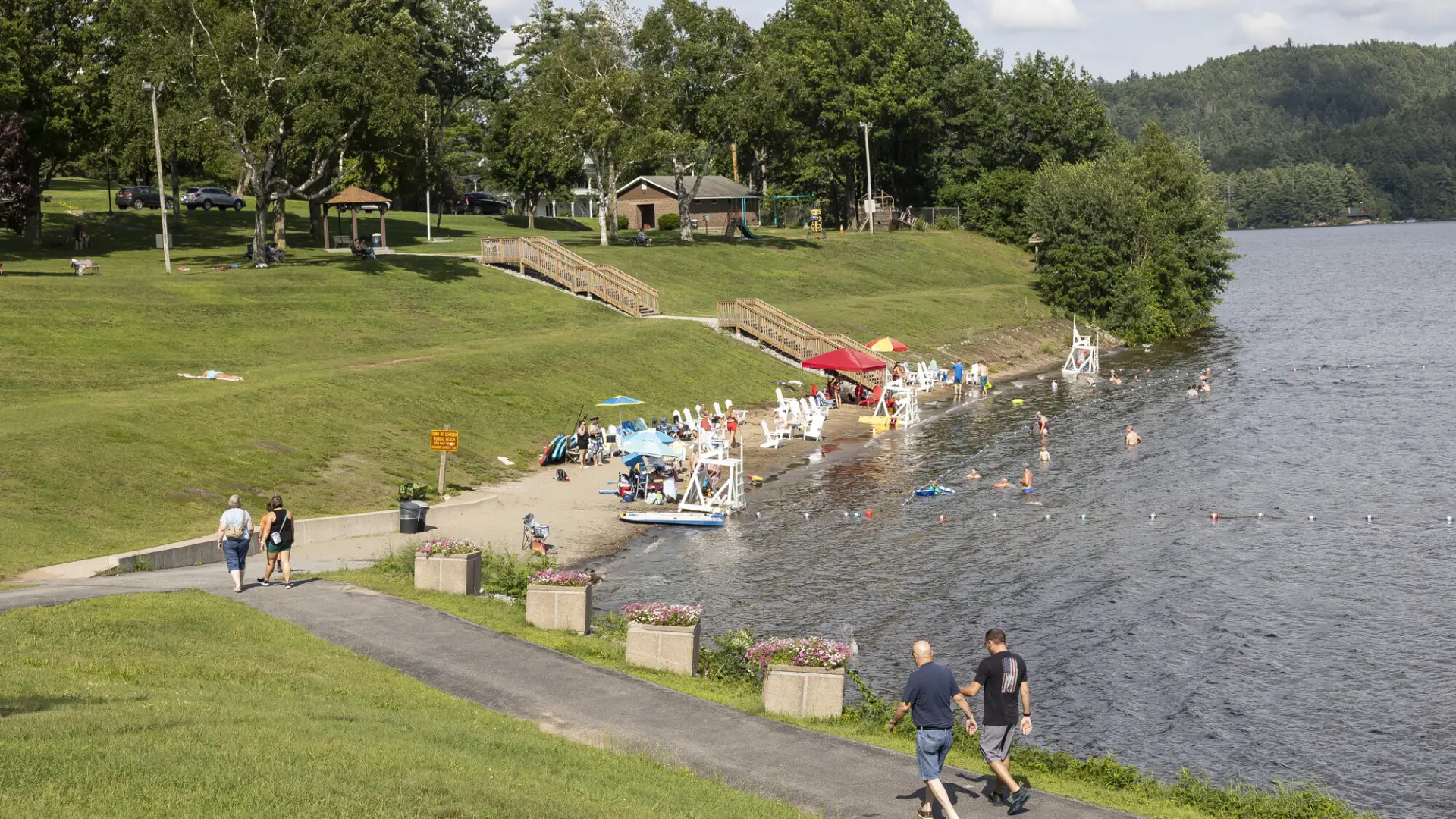 A view of a public beach and green space.