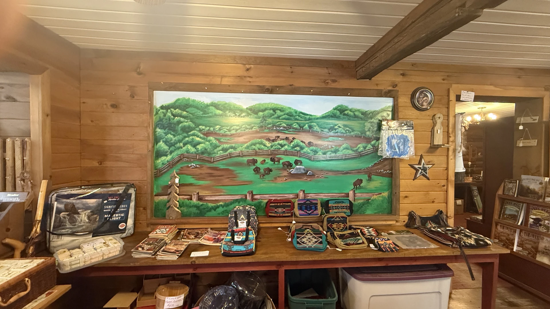 A large painting of the buffalo herd adorns a wall in the shop