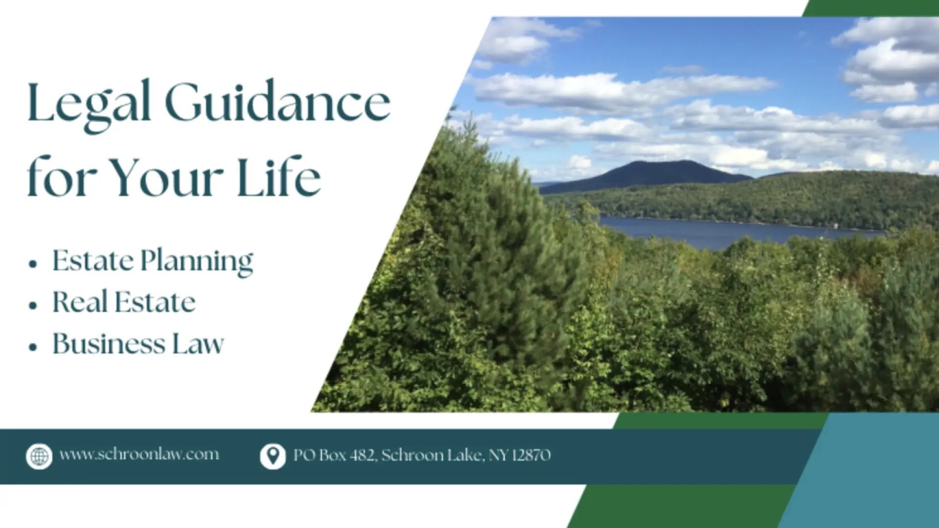 A view of water through the trees with a mountain in the distance with puffy white clouds