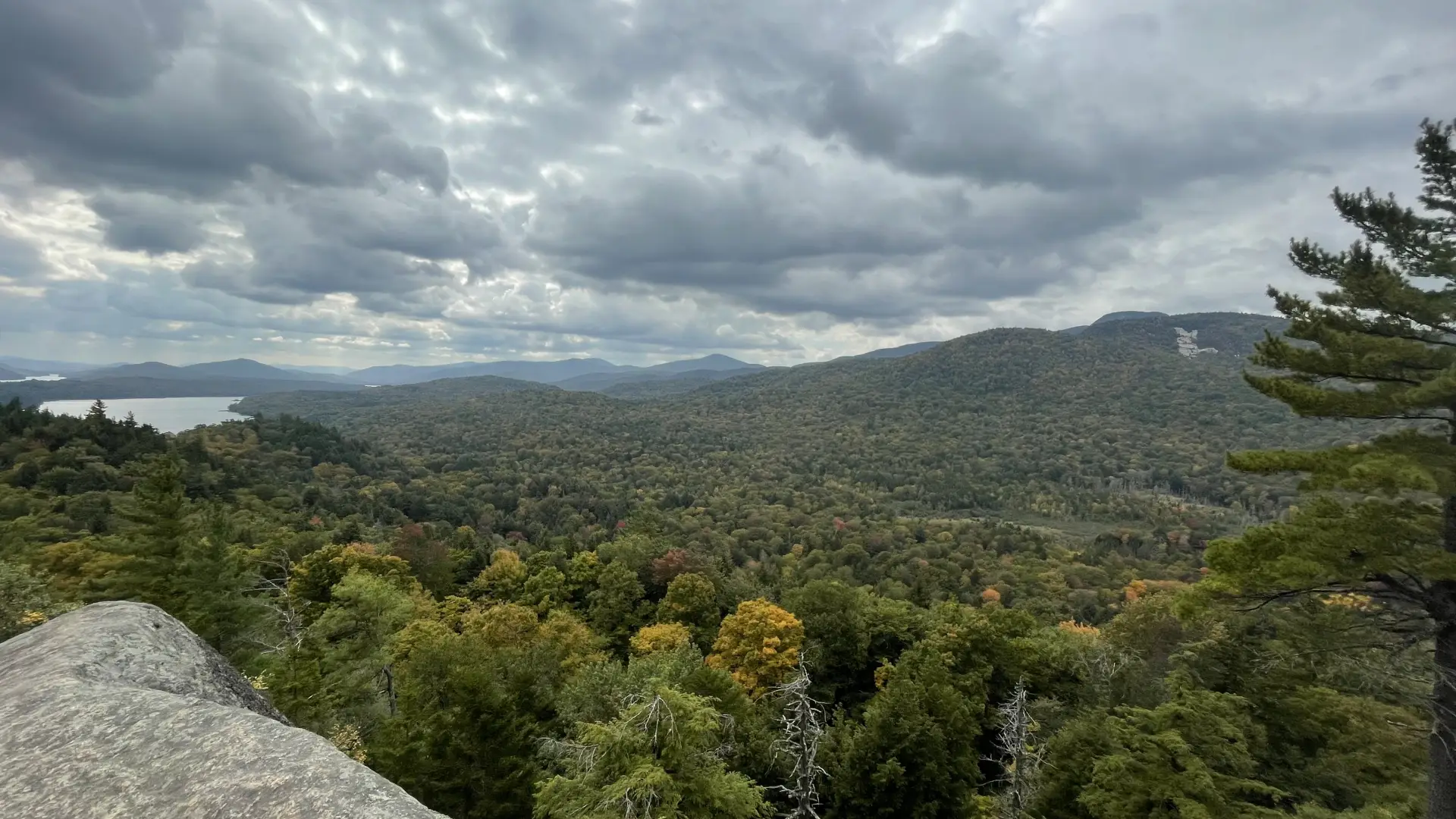 An expansive view of mountains and Indian Lake seen from Watch Hill.
