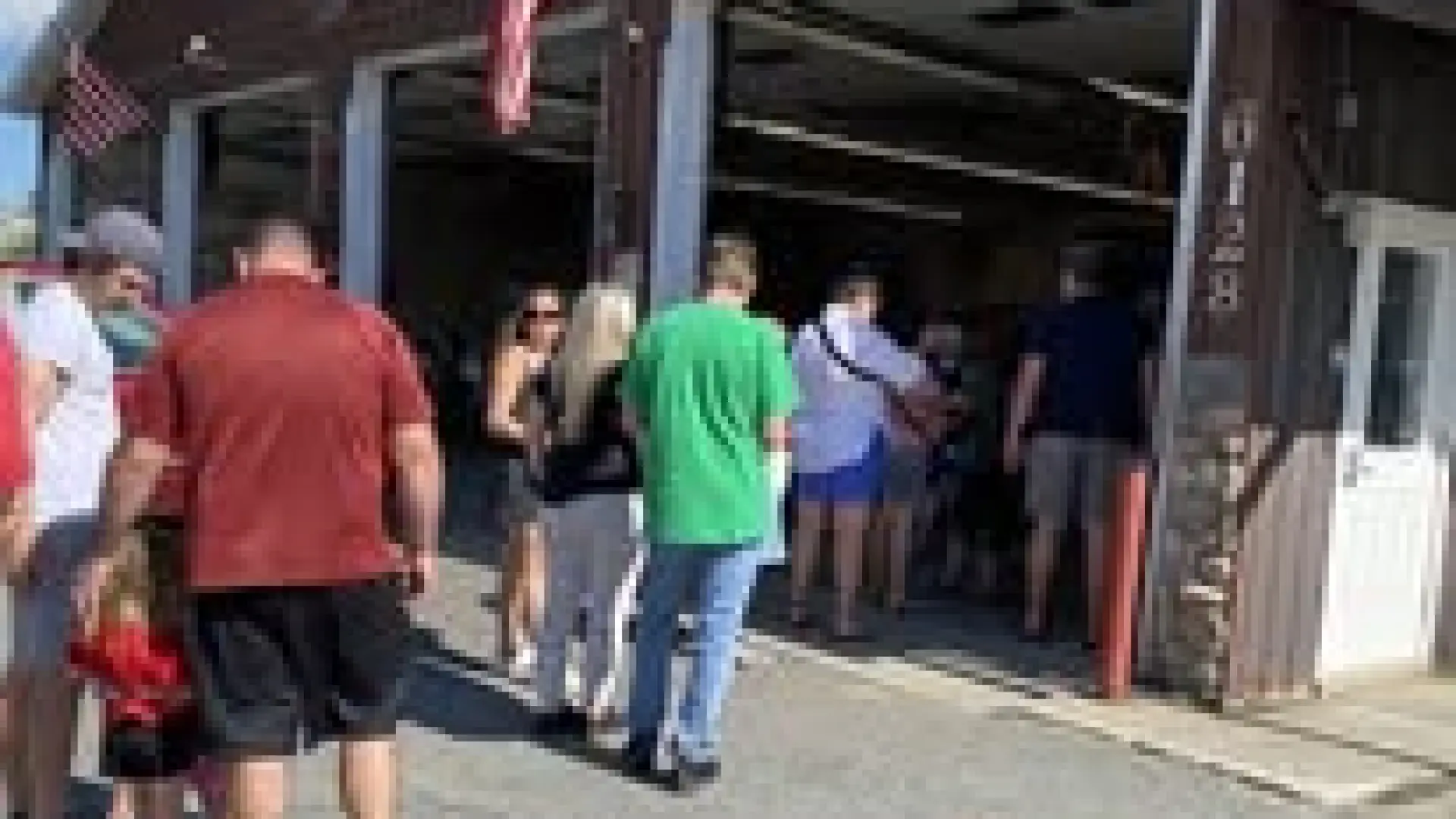 People in line at the fire department to get their chicken bbq dinner