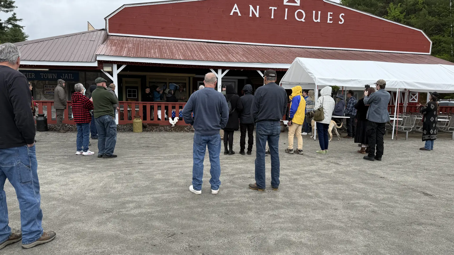 An exterior view of the red barn and entryway awning