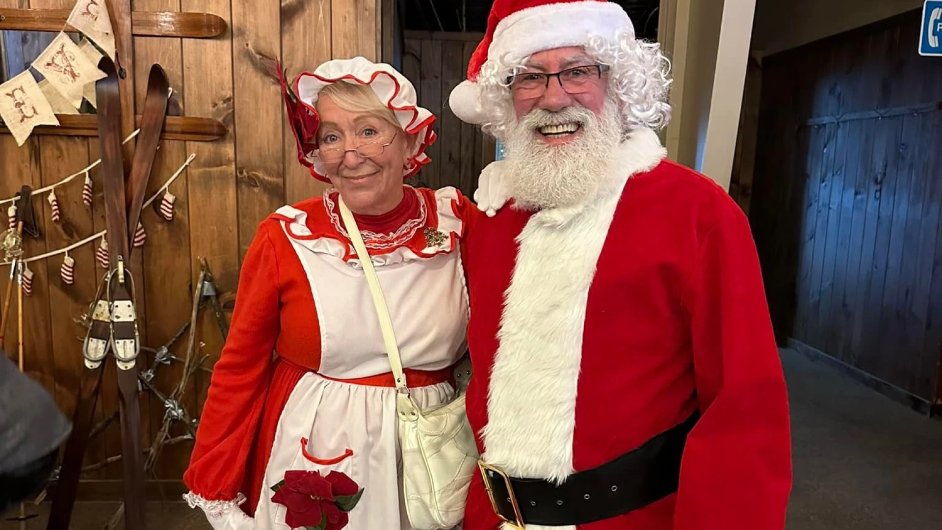 A couple dressed up as Mr & Mrs Clause