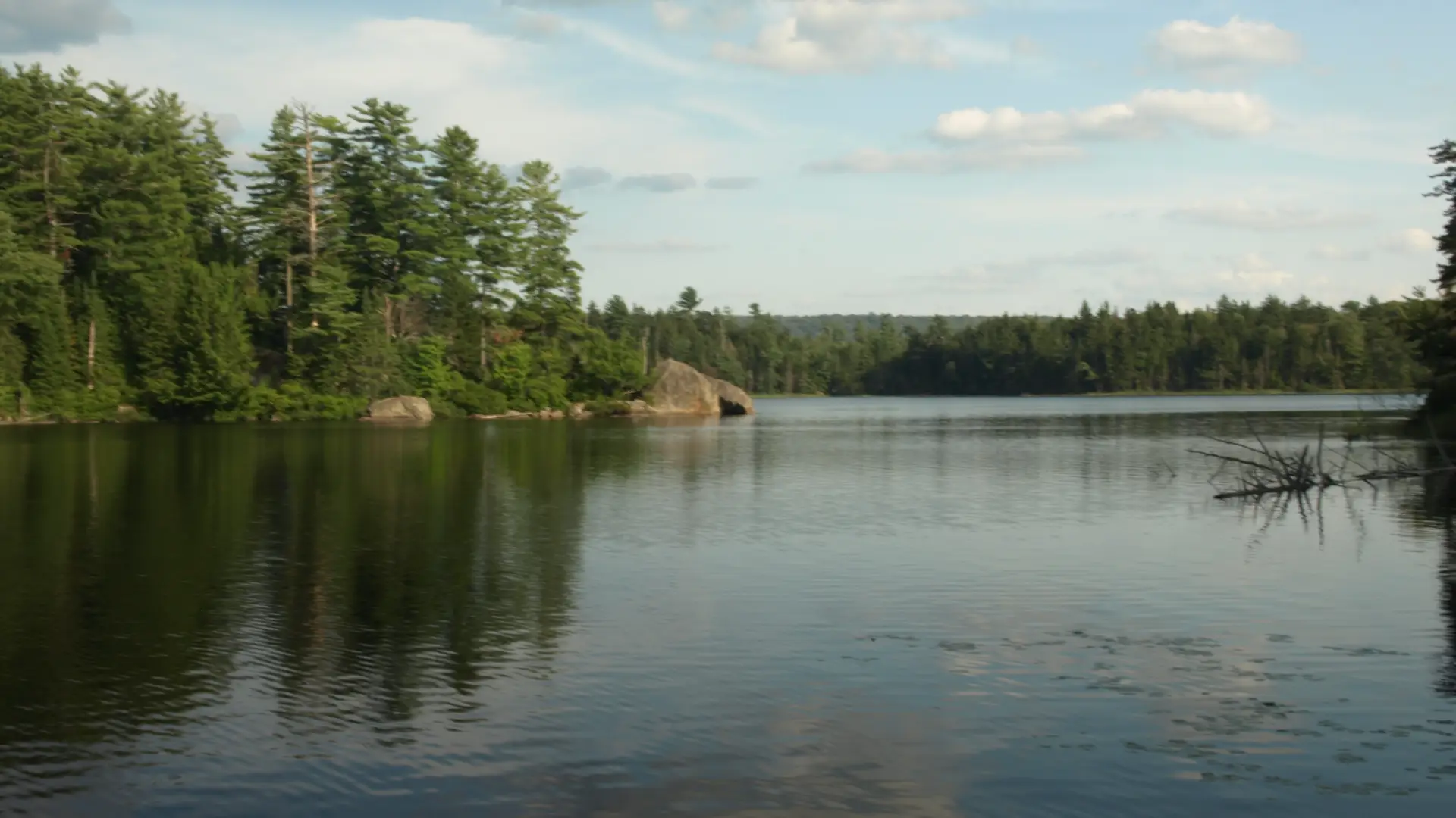 A large body of water with a rocky peninsula.