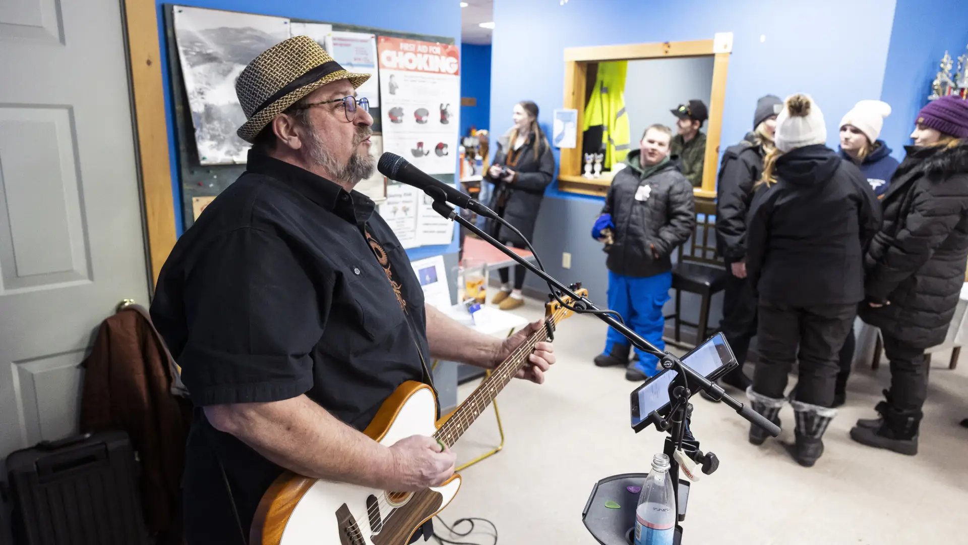 a man performing live music at the Indian Lake Welcome center