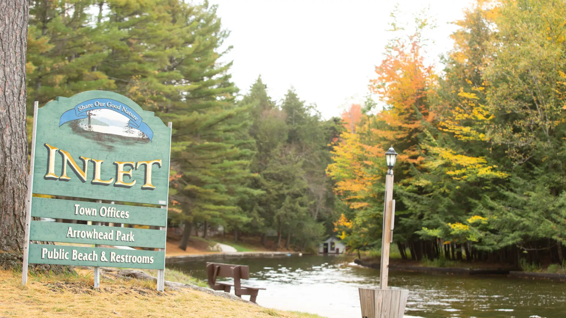 A green sign for Inlet and Arrowhead Park