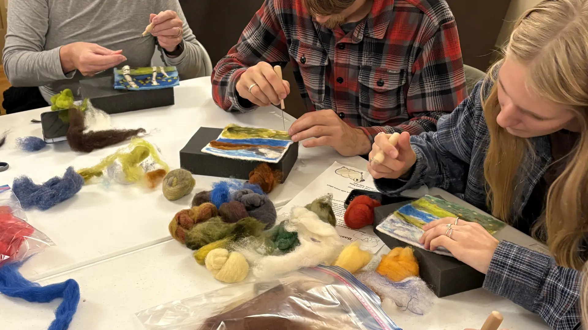 group felting scenes out of wool