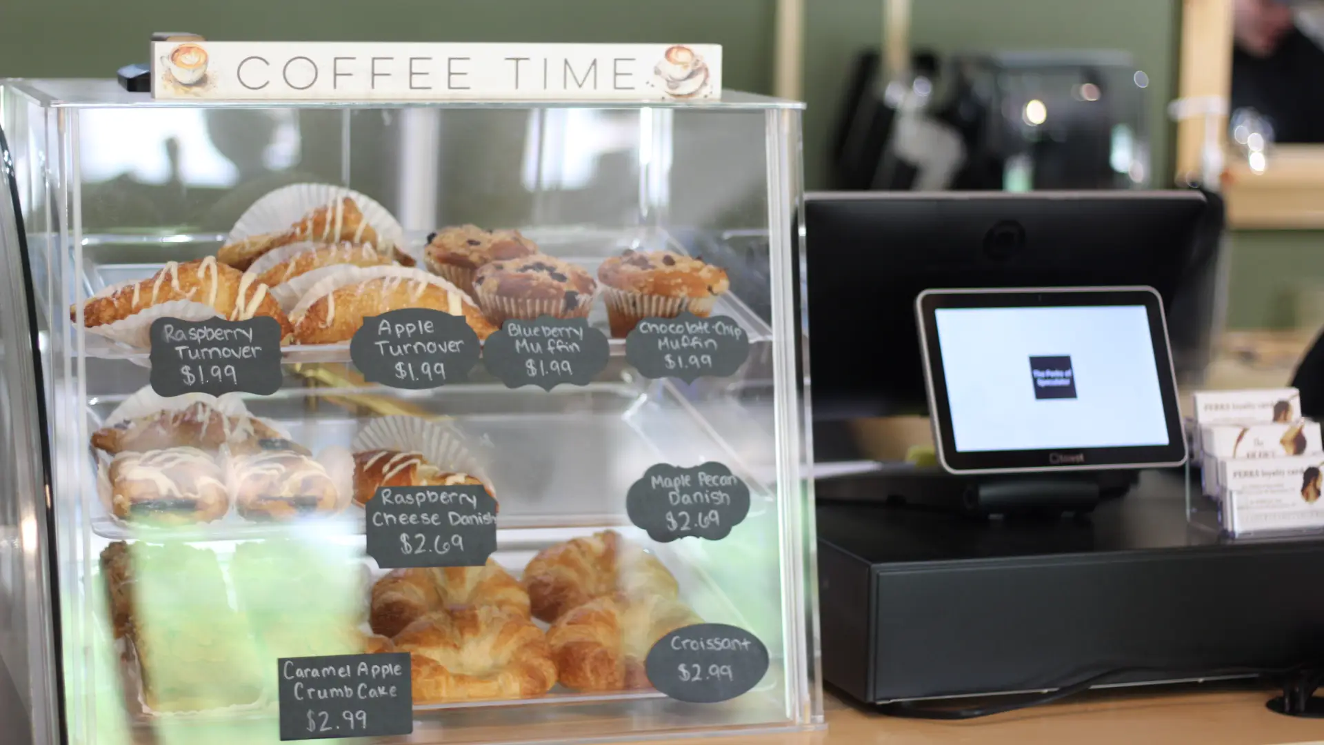 A glass case holding a variety of specialty baked goods.