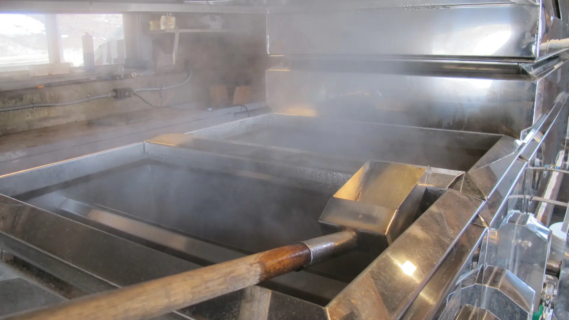 Maple syrup boilers steaming with hot sap