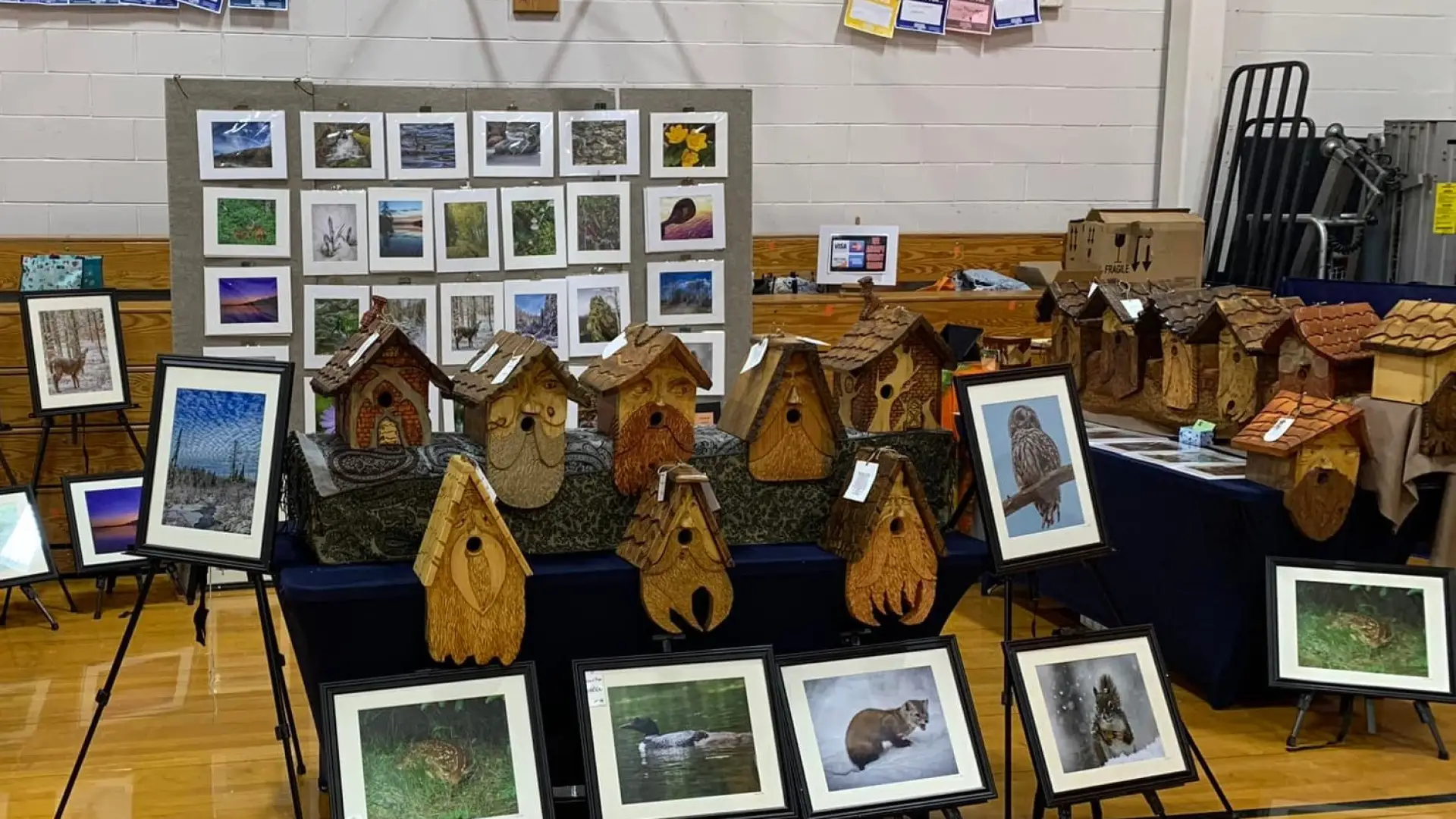 Booth of hand made bird houses and nature photography