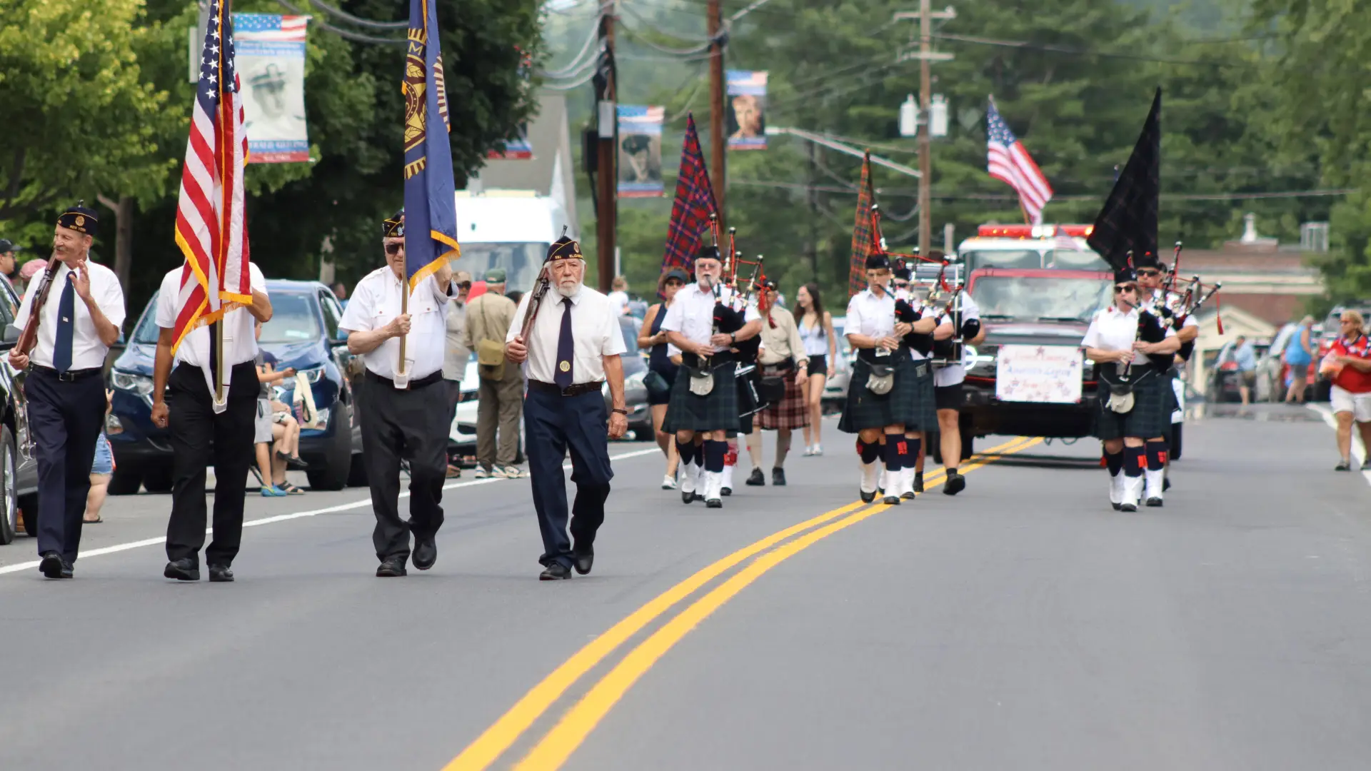 parade coming down court st with bagpipers