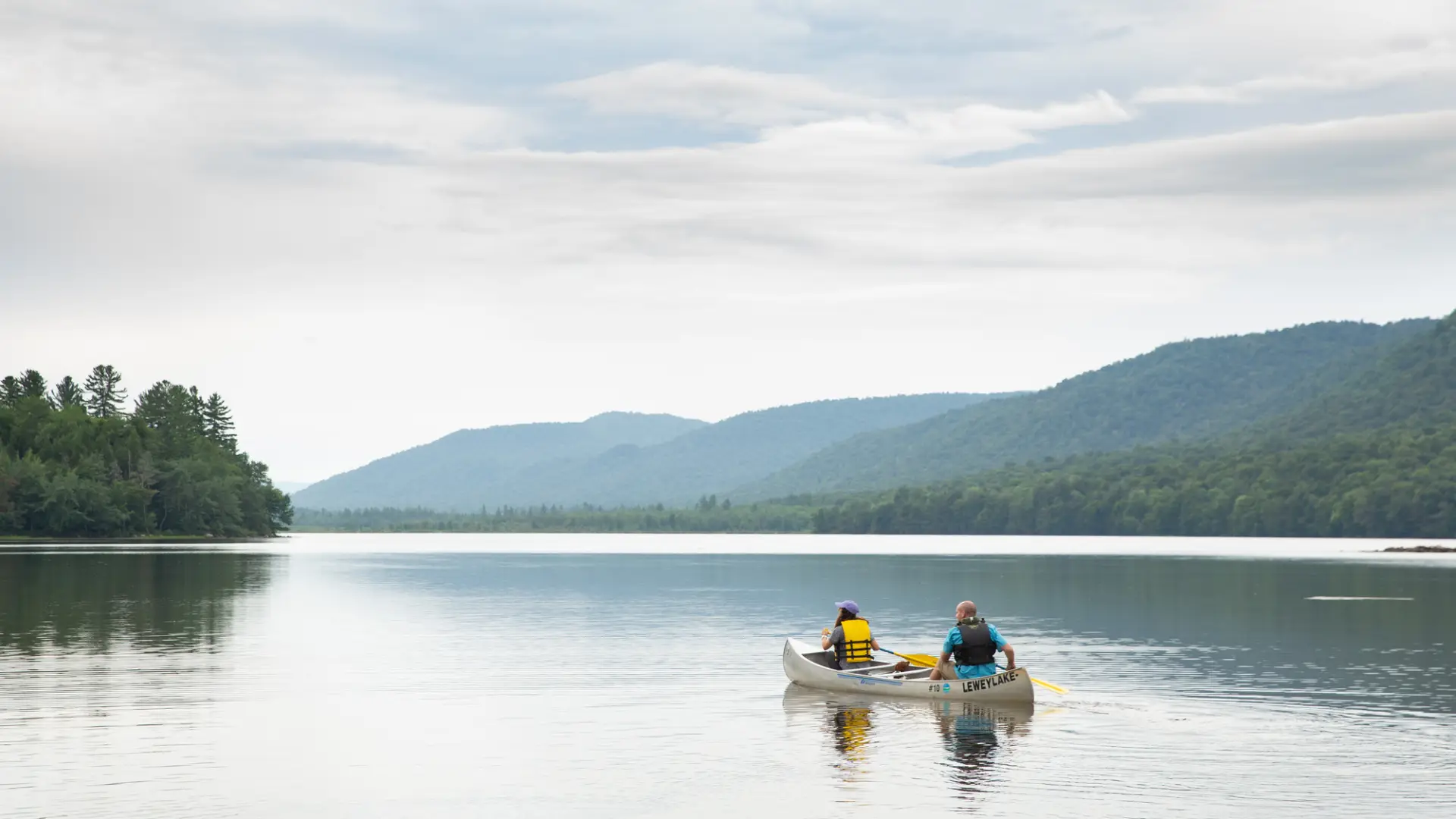 People rowing a canoe on Lewey Lake