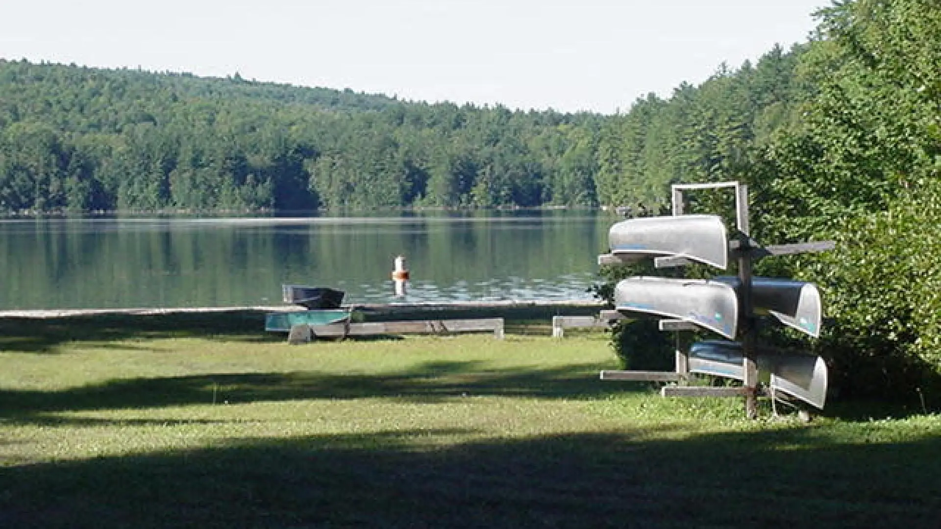 canoe rack in front of lincoln pond