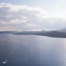A boat leaves a wake in this aerial view of Schroon Lake