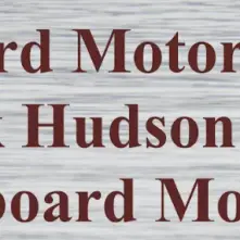 A faux wooden background with the burgundy lettering "Antique Outboard Motor Wet Swap & Meet"