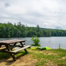 A picnic table by the water