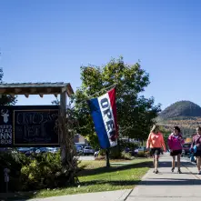 sign with mountains in the back 