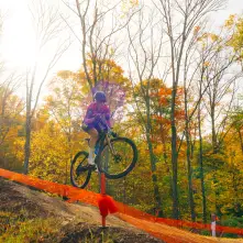 A competitor launch off of one of the jumps.