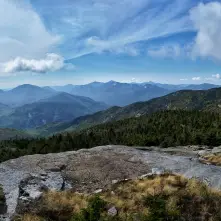 The view from a tall, rocky mountain