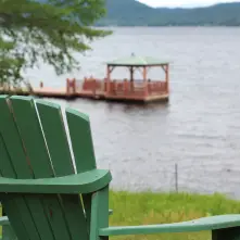 A gazebo floating on a dock in the water.