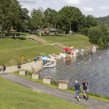 A view of a public beach and green space.