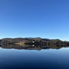 A view of the Schroon Lake as smooth as glass