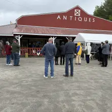 An exterior view of the red barn and entryway awning