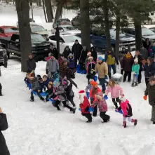 children in winter searching for candy canes