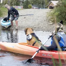 A couple kayakers by a hand launch