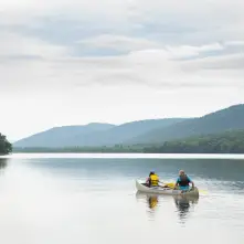 People rowing a canoe on Lewey Lake