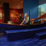 A woman rows a display boat