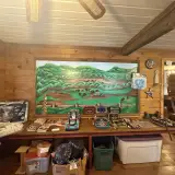 A large painting of the buffalo herd adorns a wall in the shop