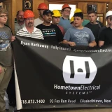 team holding up the banner