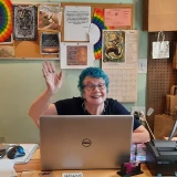 Susan behind the desk