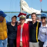 People taking a photo on a sailboat
