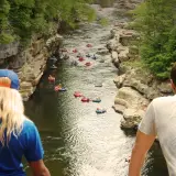 Floating down the river  surrounded by the towering walls of the chasm