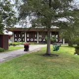 Life in the Adirondacks spelled out in large letters in the windows