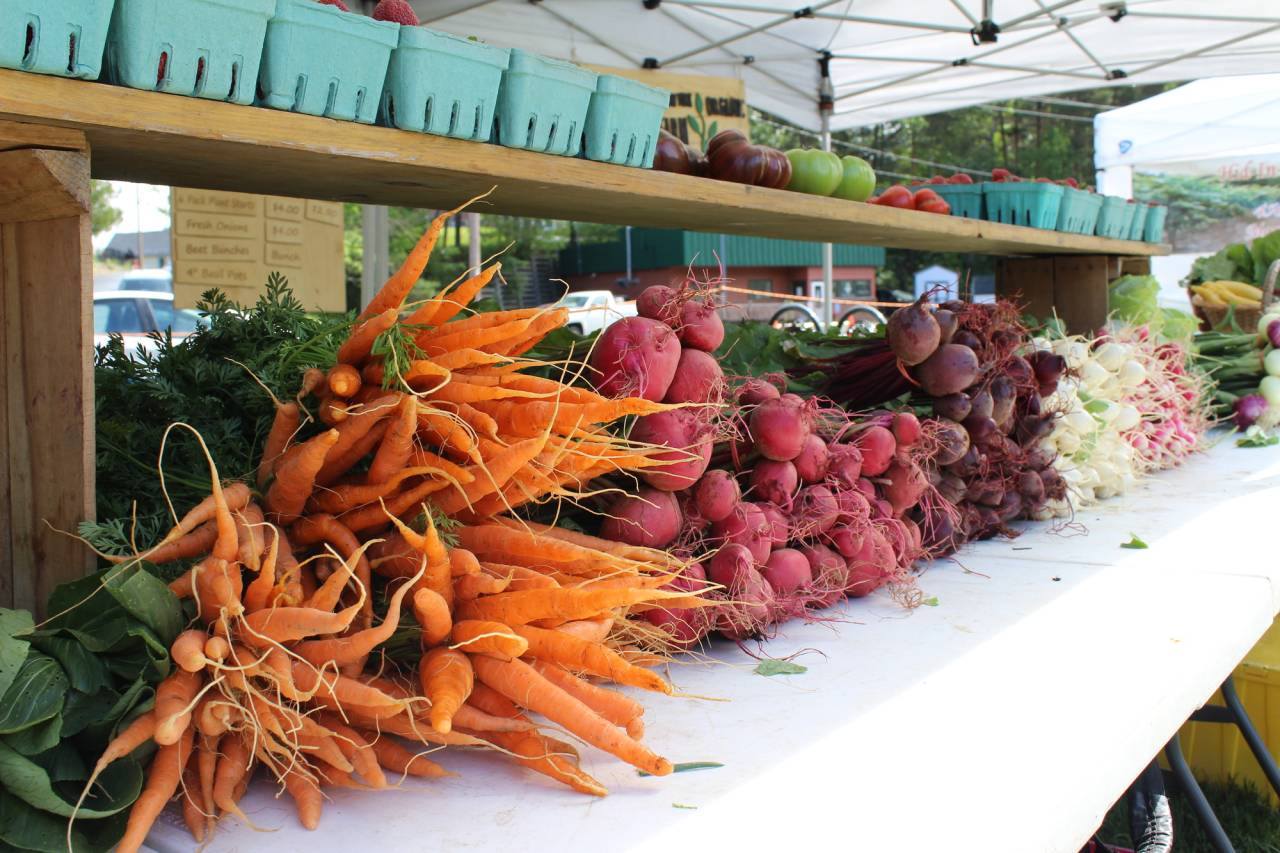 Roots and veggies at a market.