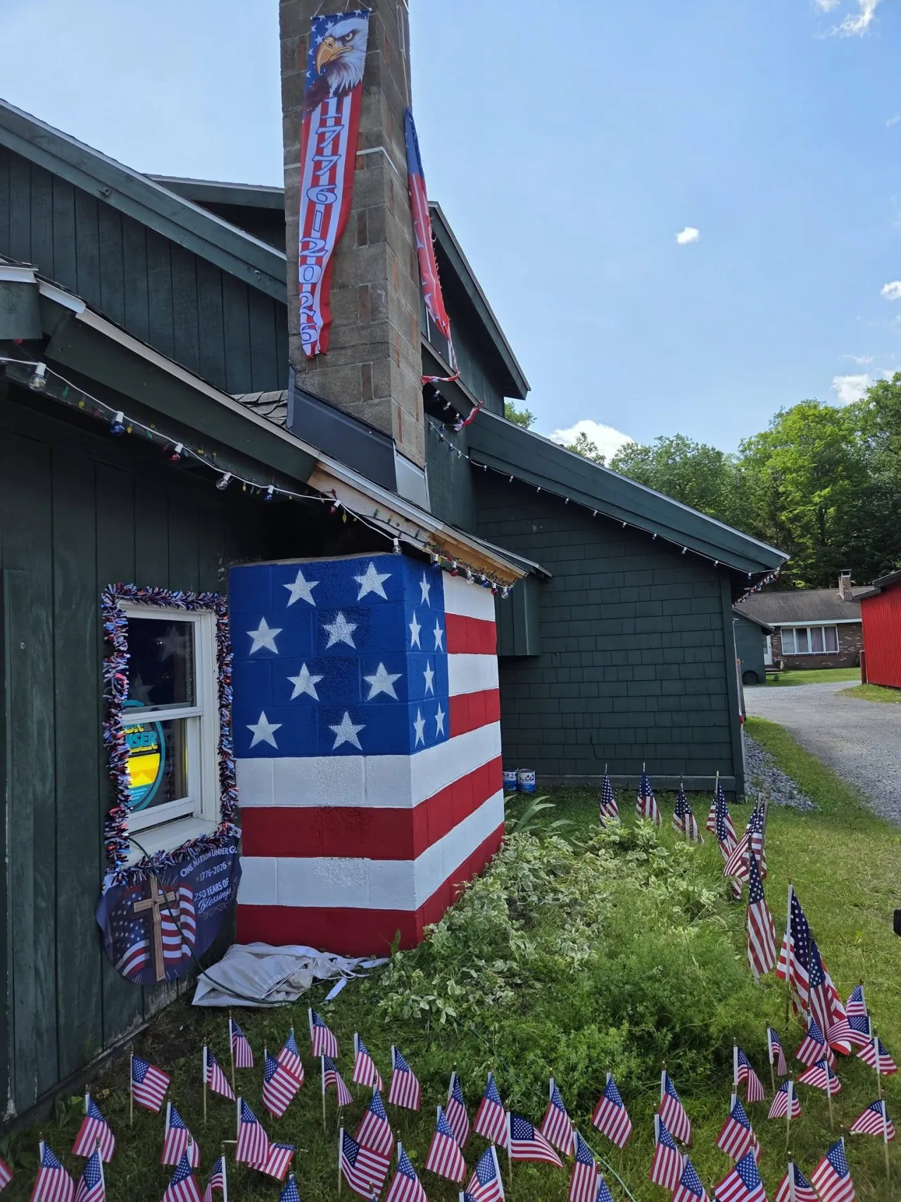 A chimney is decorated to look like an American flag.