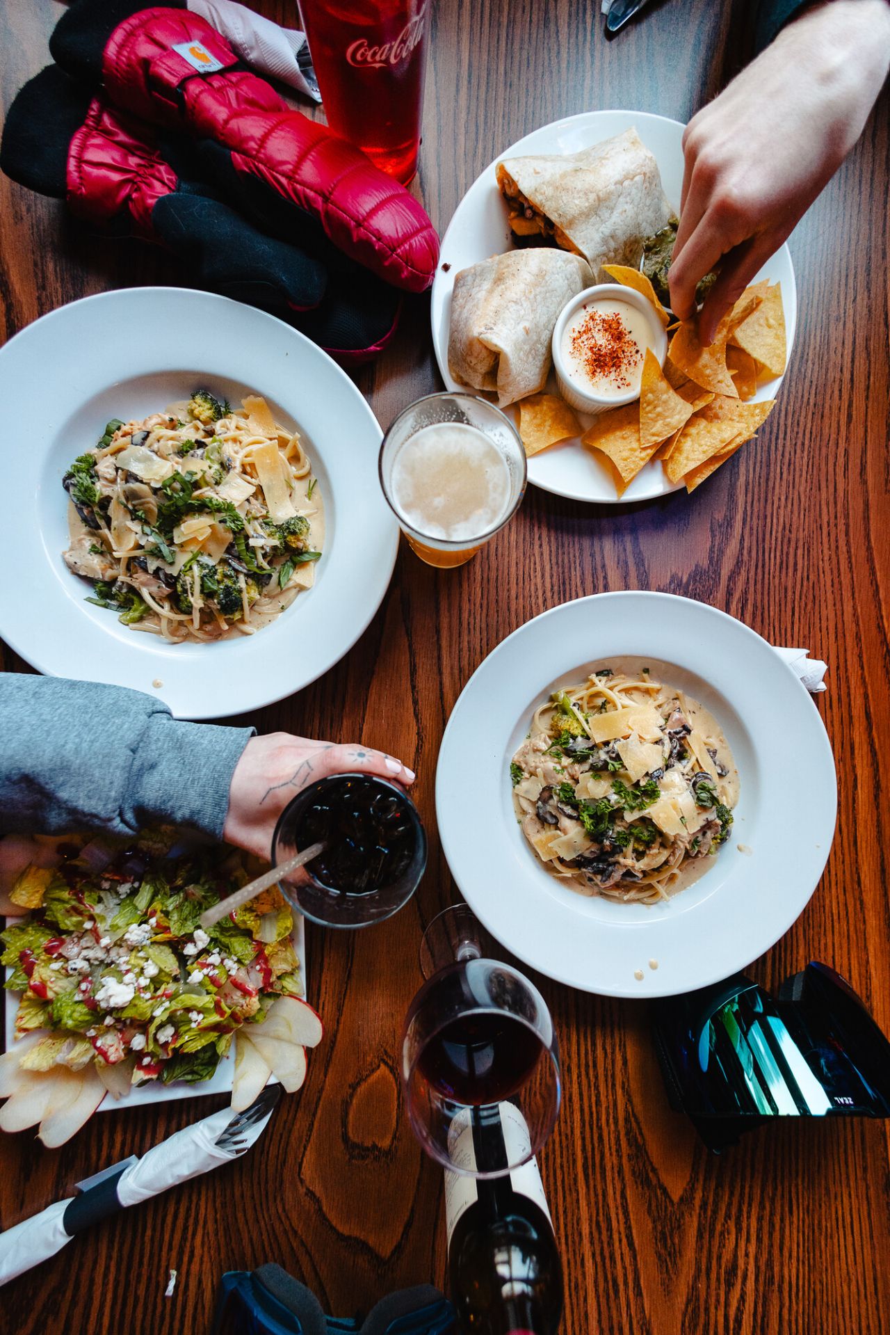 A table spread of lunch foods and drinks.