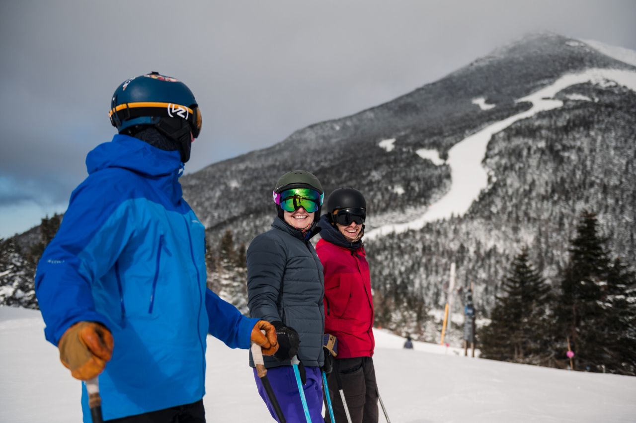 Skiers chatting at Whiteface Mountain.